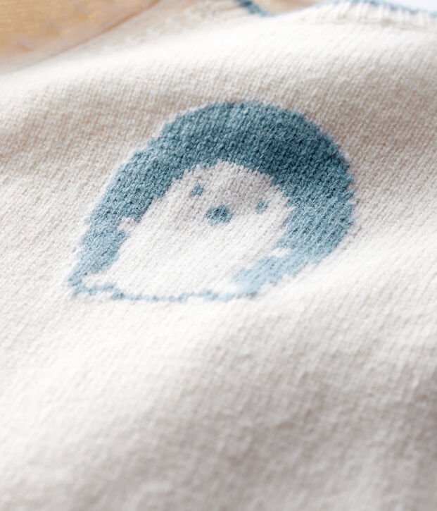 Lang babypakje van tricot, met jacquardpatroon. wit