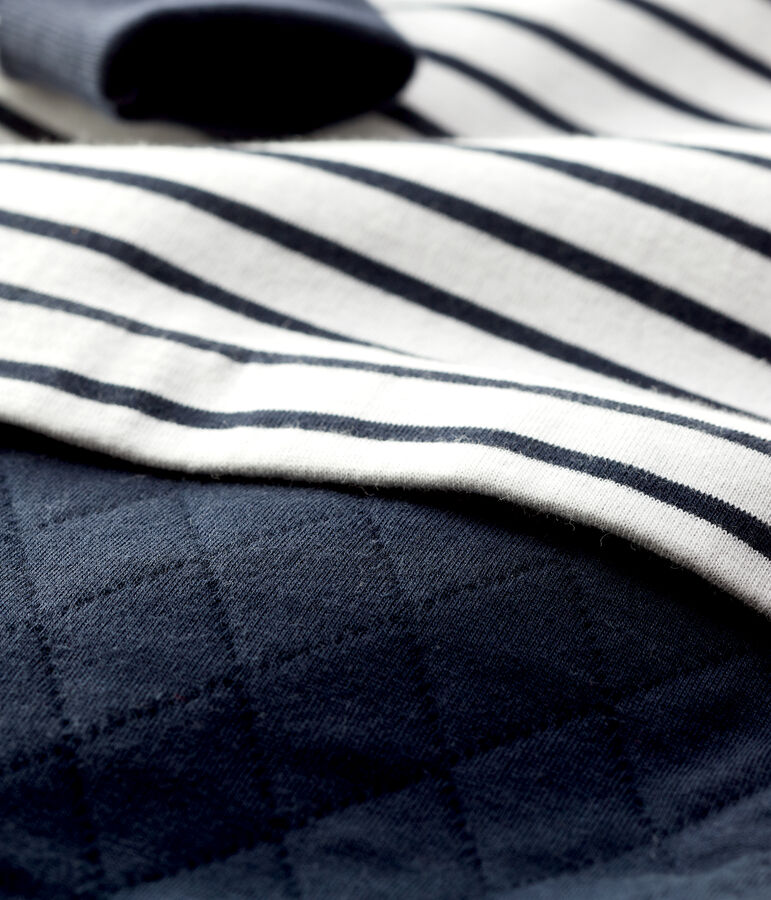 Iconische jumpsuit baby's. wit/blauw