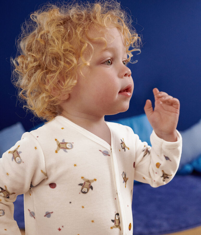 Babypyjama van velours met een print van een kleine pingu&iuml;n in de ruimte wit/multicouleur