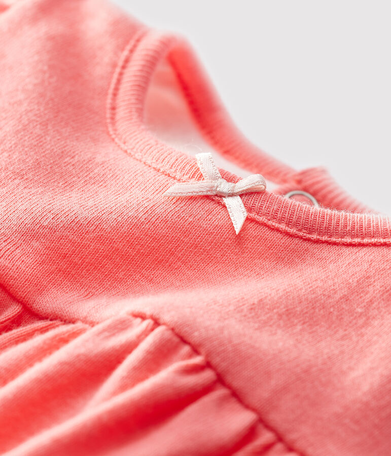 Pepsi jumpsuit voor baby van biologisch katoen oranje