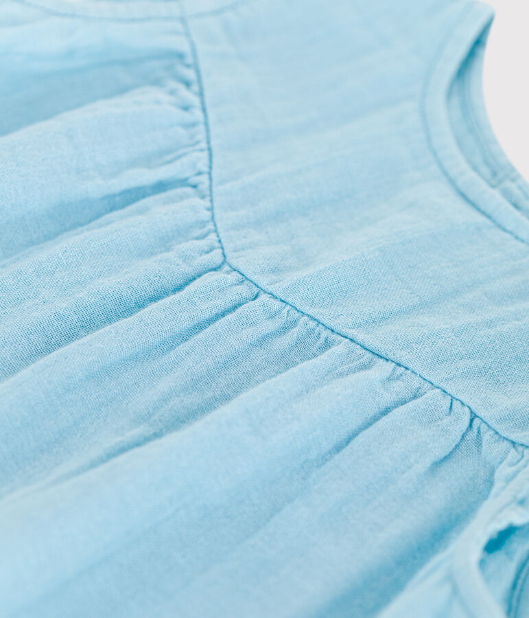 Mouwloos babyjurkje van effen katoen blauw AQUATIC