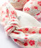 Set met babyhaarband en slofjes met bloemenmotief van biologisch katoen variante 1