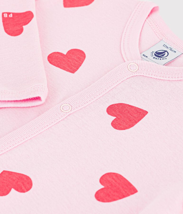 Katoenen babypyjama zonder voetjes met hartjesprint roze/oranje
