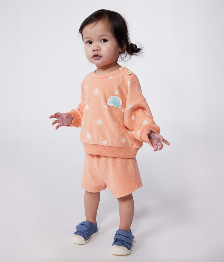 Babysweater van katoenen badstof met zonnetjesprint oranje/wit