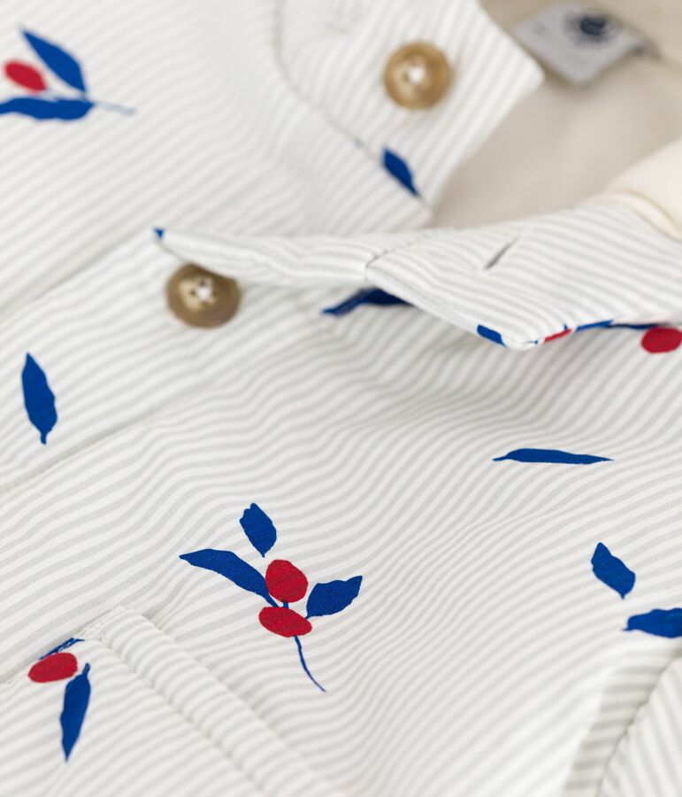 Babyjas met kap en wattering in poplin, afgewerkt met print blauw/multicouleur